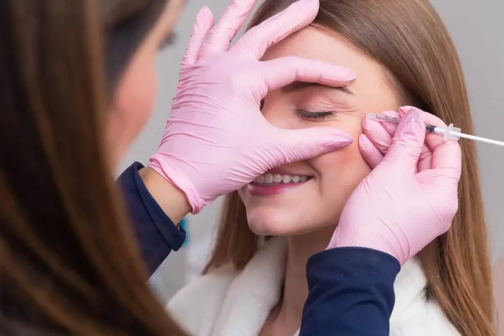 Dermal filler injection in cheek area showing aesthetic treatment process and post treatment in Humble TX