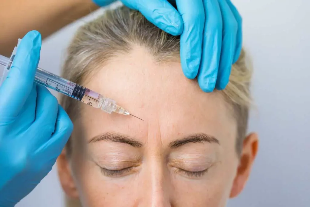 Patient receiving Dysport treatment for forehead and frown lines at Centurion Injects & IV Drips in Humble, TX