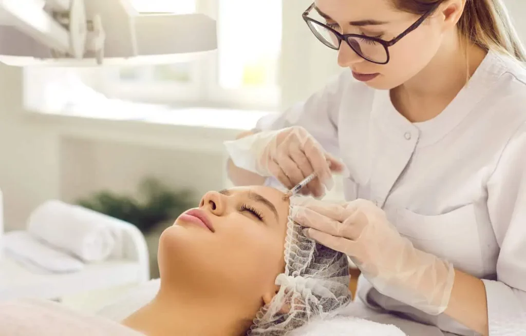 Provider administering Sculptra facial injections for collagen stimulation and skin firming at Centurion Injects & IV Drips in Humble, TX