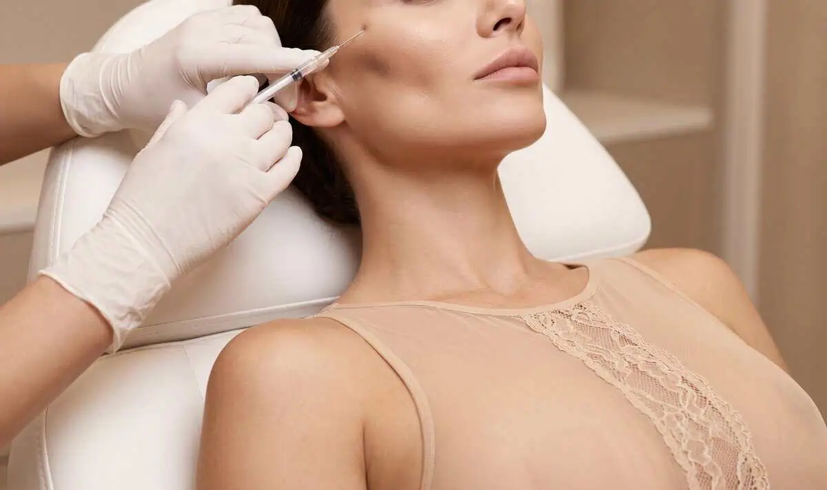 Provider performing a facial injectable treatment for facial rejuvenation in Humble, TX.